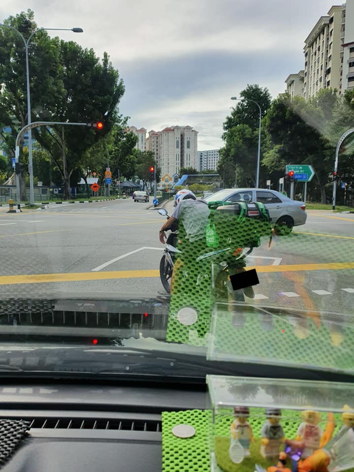 Rider collapsed on his motorbike; good samaritan takes care of him and helps to deliver his order